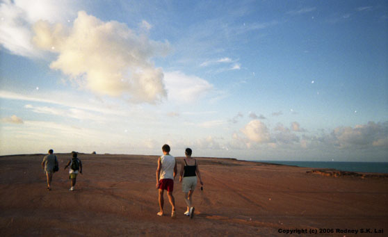 John, Angel, Tim, and Michaela walk along the cliffs